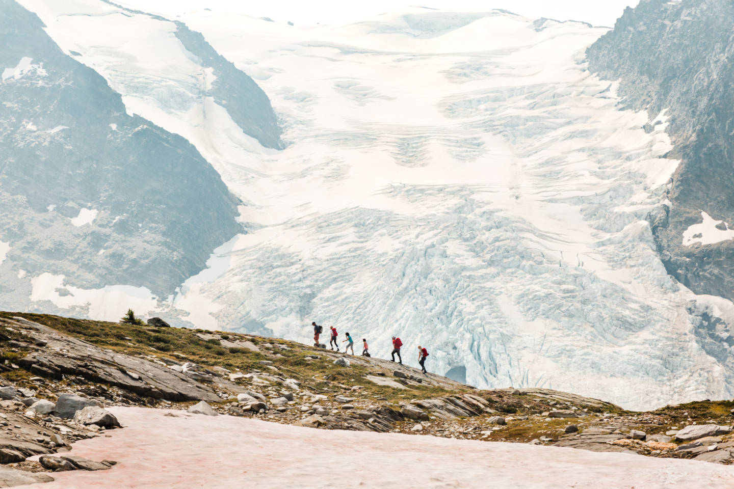 A family walks in the mountains at CMH Cariboos