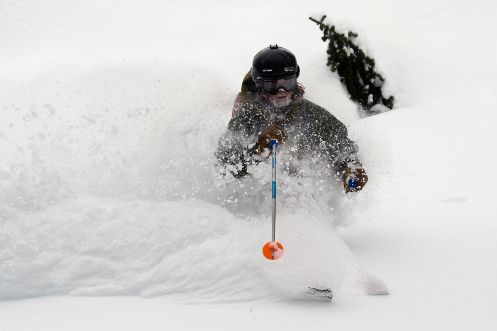 A heli-skier blasting through powder in December at CMH Galena. 