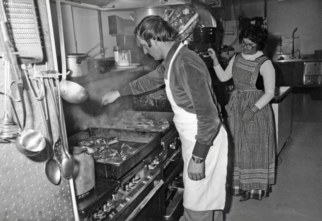 Historical photo of Leo and Lynne Grillmair cooking in the kitchen.